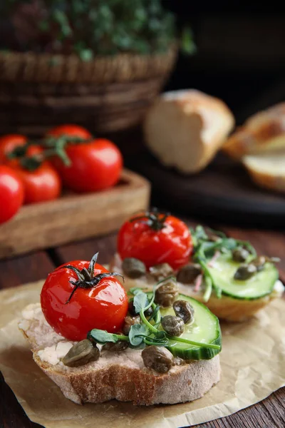 Tasty Bruschettas Vegetables Capers Served Wooden Table Closeup — Stock Photo, Image