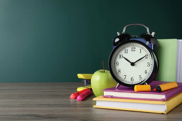 Alarm Clock Different Stationery Wooden Table Green Chalkboard Space Text — Stock Photo, Image