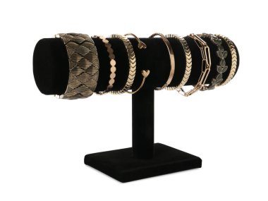 Beyaz arka planda şık bilezikleri olan T-Bar mücevher standı.