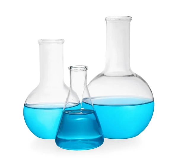 Different Laboratory Glassware Light Blue Liquid White Background — Stock Photo, Image