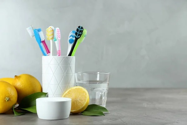 Toothbrushes Lemons Bowl Baking Soda Grey Table Space Text — Stock Photo, Image