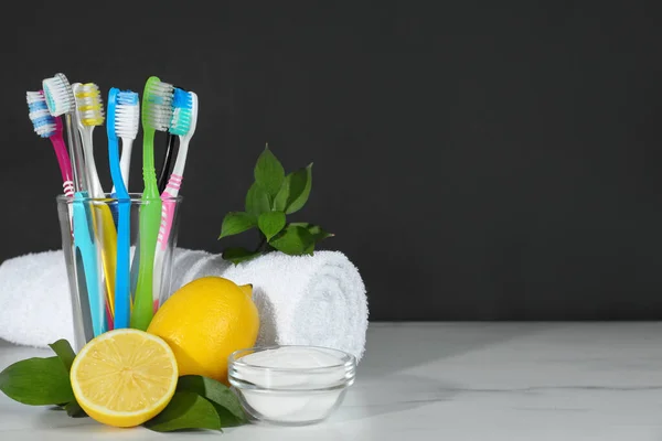Toothbrushes Lemons Bowl Baking Soda White Table Black Background Space — Stock Photo, Image