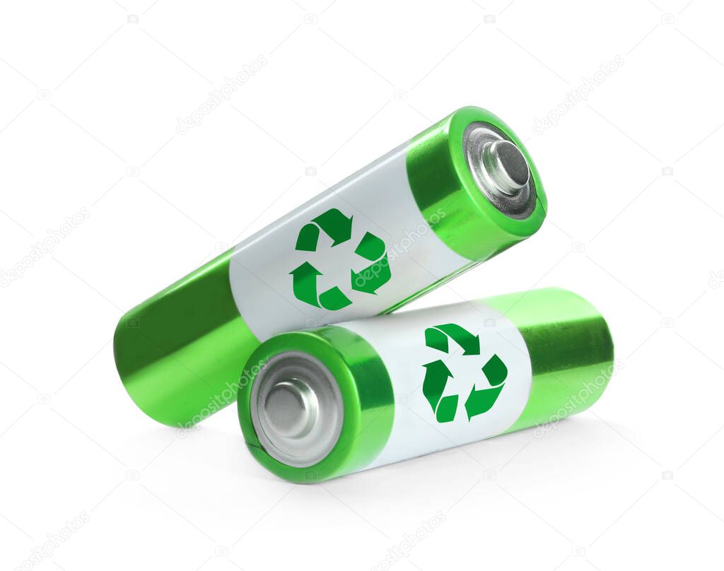 Batteries with recycle symbols on white background