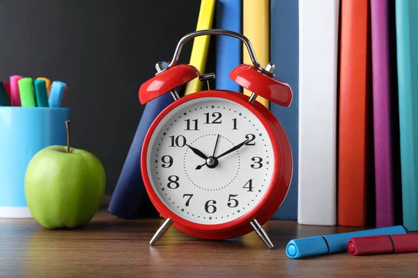 Alarm Clock Different Stationery Wooden Table Blackboard School Time — Stock Photo, Image