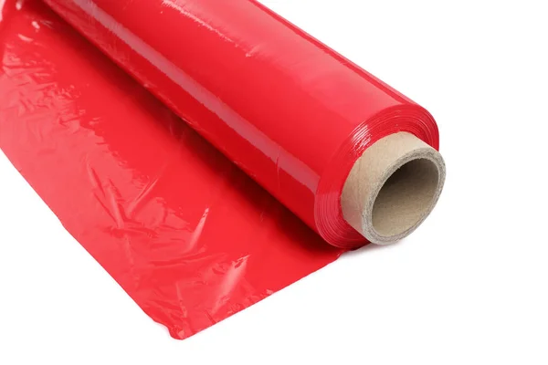 Roll of red plastic stretch wrap film isolated on white, closeup