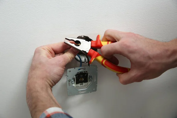 Electrician Pliers Repairing Power Socket Closeup — Stock Photo, Image