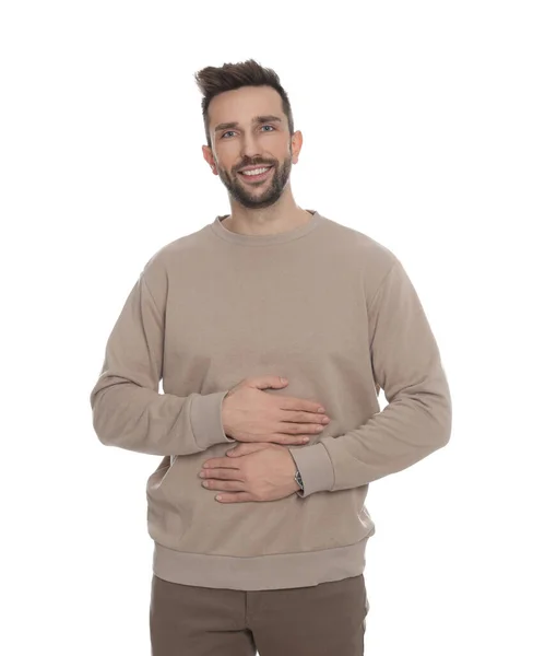 快乐的男人在白色背景下摸着自己的肚子 健康胃的概念 — 图库照片