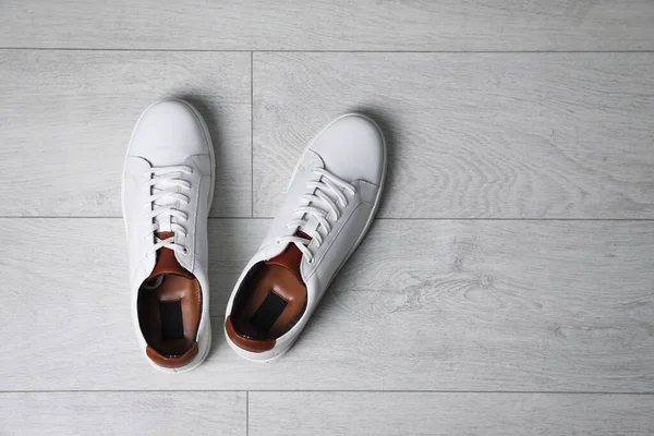 Pair Stylish Sports Shoes White Wooden Floor Flat Lay Space — Stock Photo, Image