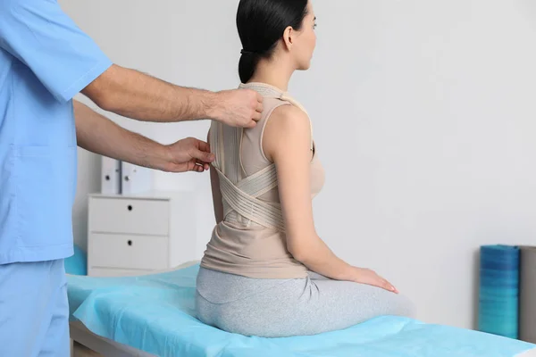 Orthopedist Helping Patient Put Posture Corrector Clinic Closeup Scoliosis Treatment — Stock Photo, Image