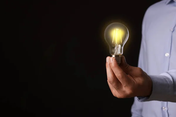 Glow Your Ideas Closeup View Man Holding Light Bulb Black — Stock Photo, Image
