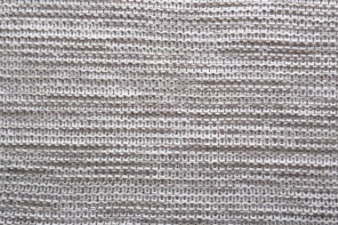 Arka plan olarak güzel gri örülmüş kumaş, üst görünüm
