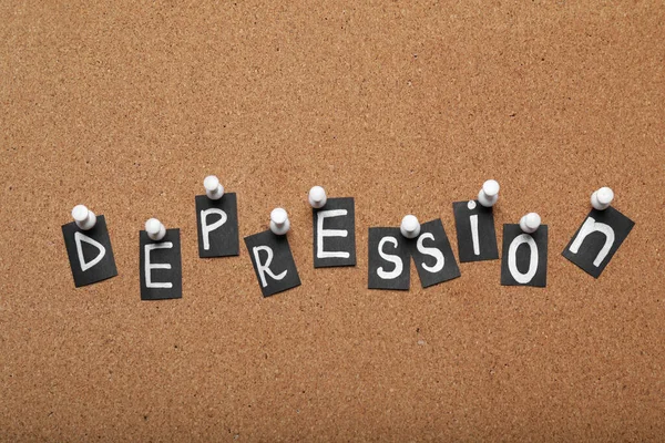 段ボールに固定された文字で作られた単語うつ病 — ストック写真