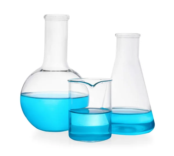 Different Laboratory Glassware Light Blue Liquid White Background — Stock Photo, Image