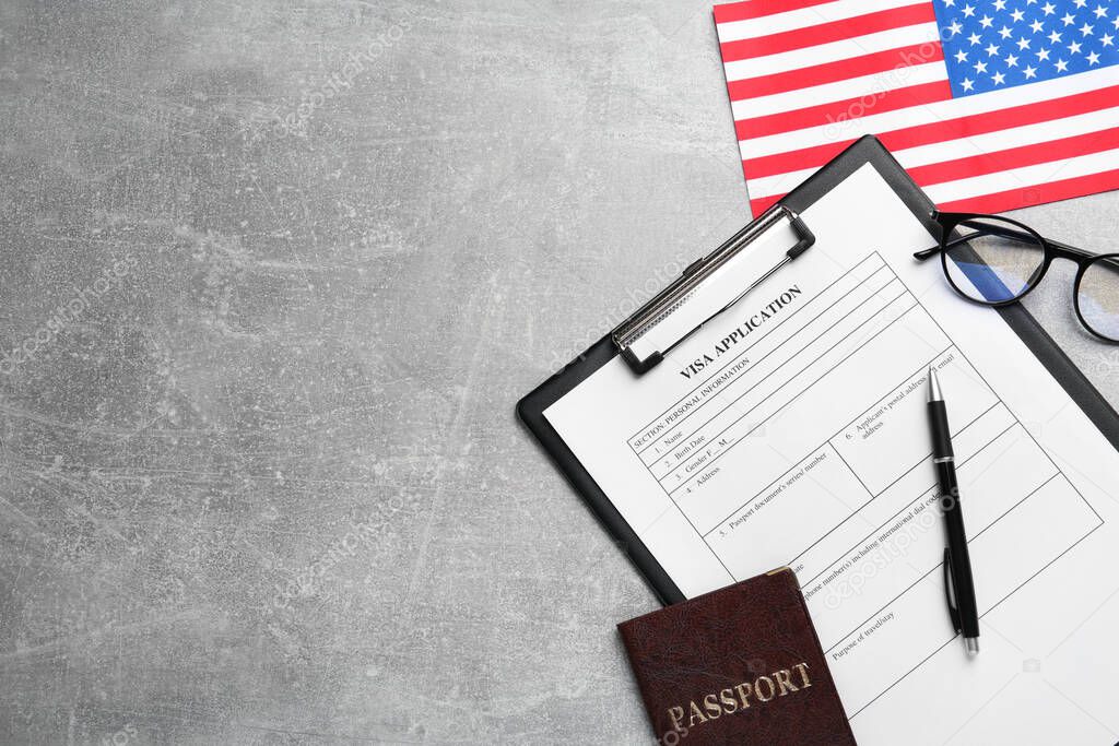 American flag, visa application form, passport and glasses on light grey table, flat lay. Space for text