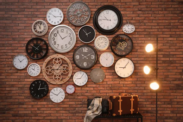 Collection Clocks Hanging Red Brick Wall Indoors — Stock Photo, Image