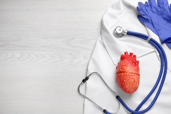 Flat Lay Composition Stethoscope Red Heart Model White Wooden Table — Stock Photo, Image