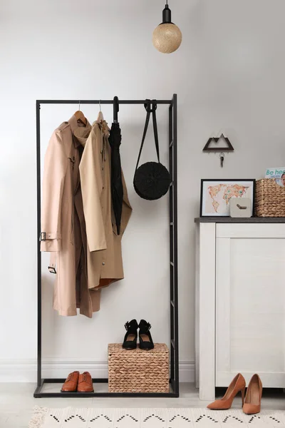 Modern hallway interior with stylish furniture and key holder