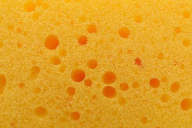 Arkaplan olarak sarı temizlik süngeri, üst görünüm