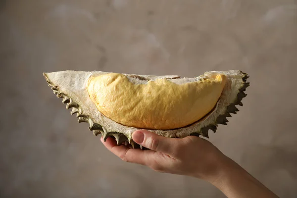 Woman Holding Piece Ripe Durian Fruit Grey Background Closeup — Stock Photo, Image