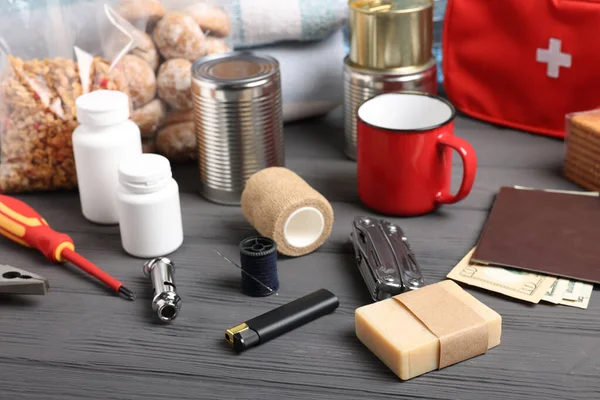 stock image Disaster supply kit for earthquake on black wooden table