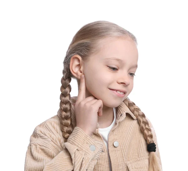 Linda Niña Apuntando Oreja Sobre Fondo Blanco —  Fotos de Stock