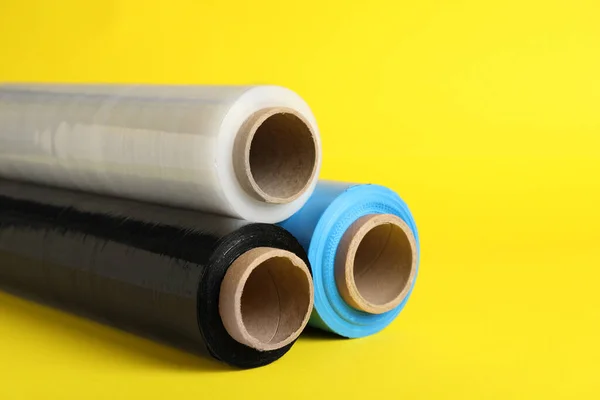 Rolls Different Stretch Wrap Yellow Background Closeup — Stock fotografie