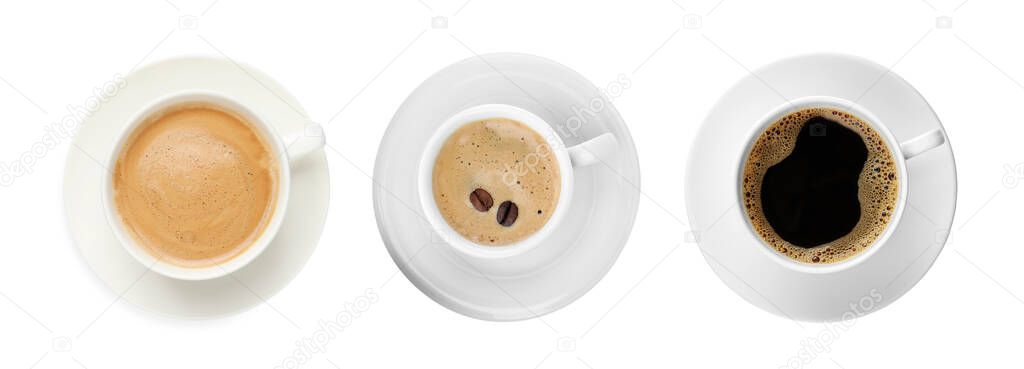Set of cups with aromatic hot coffee on white background, top view. Banner design