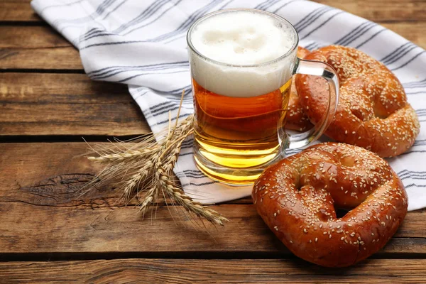 Tasty Pretzels Glass Beer Wheat Spikes Wooden Table — Stock Photo, Image