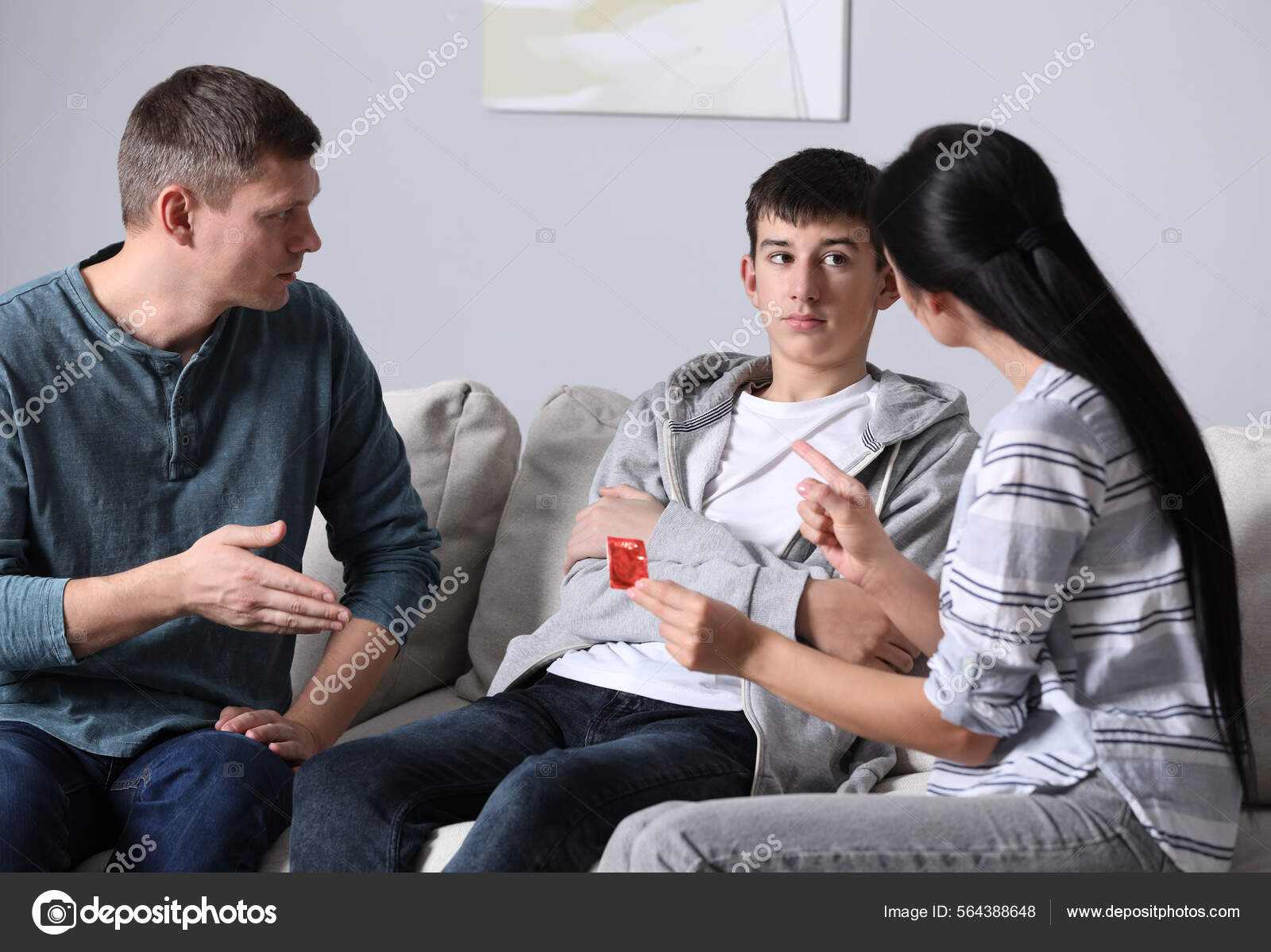 Parents Talking Teenage Son Contraception Home Sex Education Concept Stock Photo by ©NewAfrica 564388648