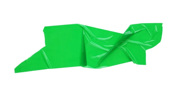 トップビューに隔離された緑の粘着テープのピース — ストック写真