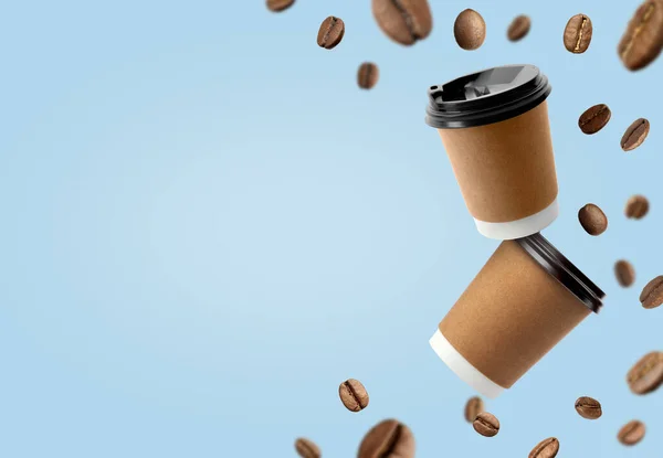 Coffee Paper Cups Roasted Beans Flying Light Blue Background Space — 스톡 사진