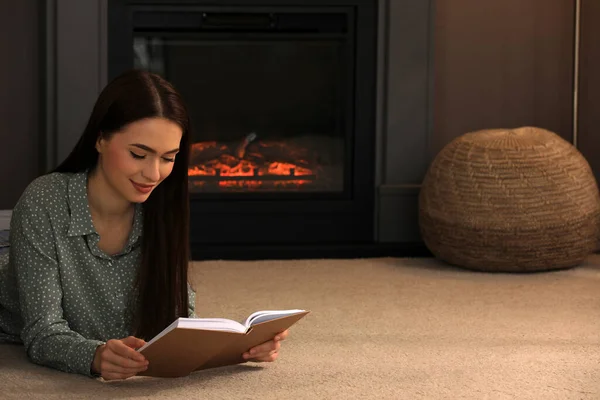 Beautiful Young Woman Reading Book Floor Fireplace Home Space Text — Stock Fotó