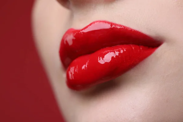 Closeup View Beautiful Young Woman Perfect Lips Makeup Red Background — Stockfoto