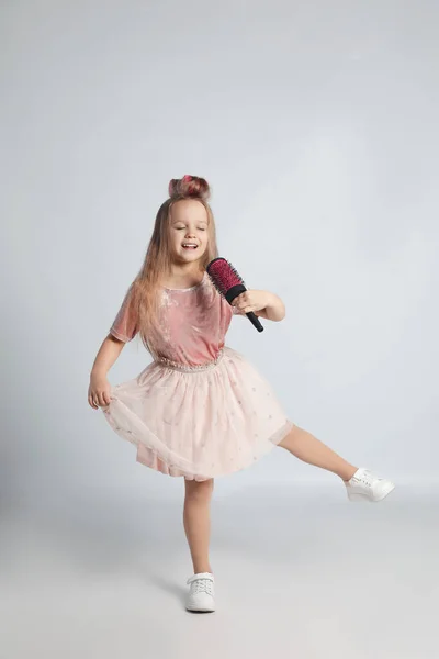Cute Little Girl Hairbrush Singing Light Grey Background — Stockfoto