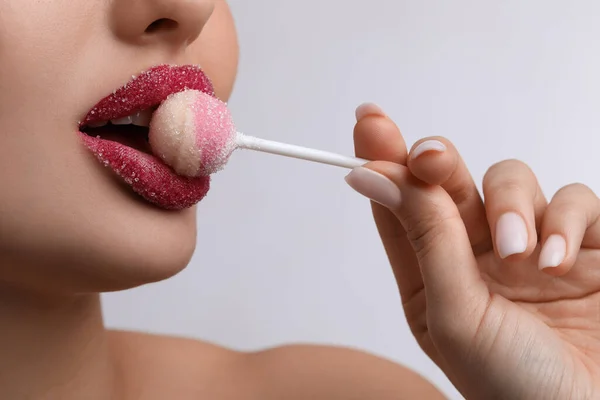 Young Woman Beautiful Lips Covered Sugar Eating Lollipop Light Background — Foto de Stock