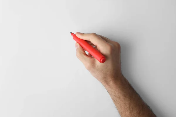 Man Holding Red Marker White Background Top View — Foto de Stock