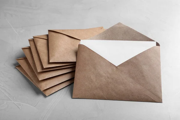 Many Brown Paper Envelopes Light Grey Table — 스톡 사진