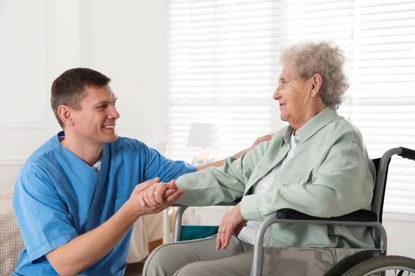 Caregiver Assisting Senior Woman Wheelchair Indoors Home Health Care Service — Stock Photo, Image