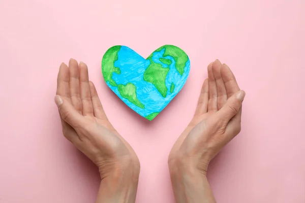 Woman Heart Shaped Model Planet Pink Background Flat Lay Earth — Stock Fotó