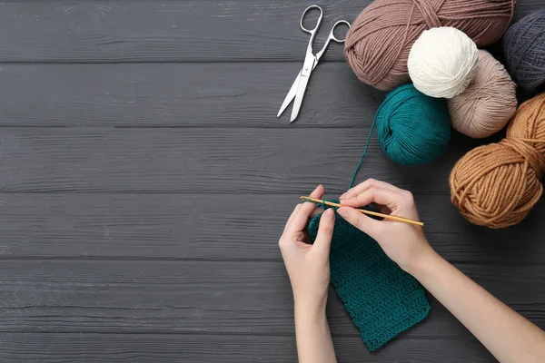 Woman Crocheting Teal Thread Grey Wooden Table Top View Space — Photo