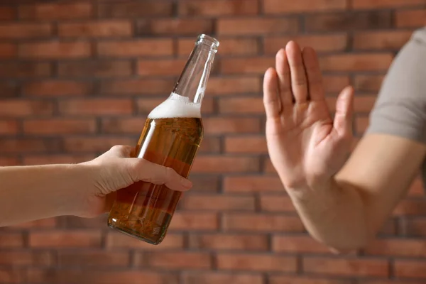 Man Refusing Drink Beer Red Brick Wall Closeup Alcohol Addiction — Zdjęcie stockowe