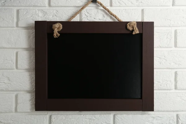 Clean Small Black Chalkboard Hanging White Brick Wall — Fotografia de Stock