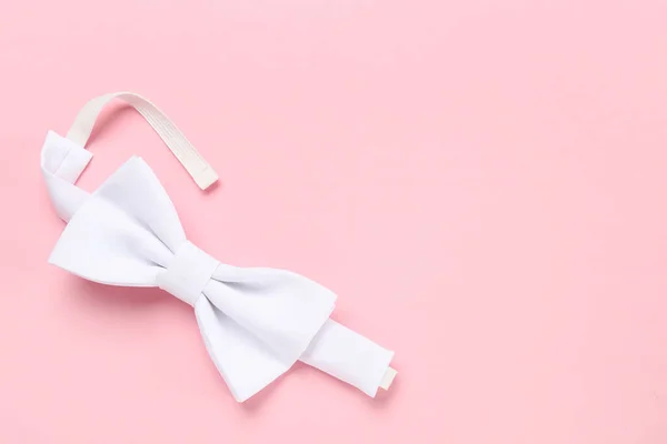 Stylish White Bow Tie Pink Background Top View Space Text — Zdjęcie stockowe