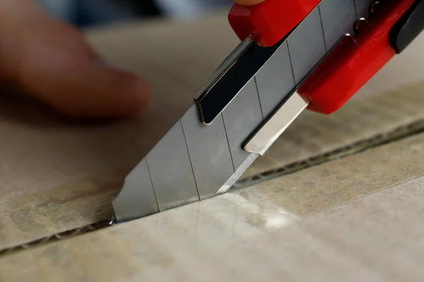 Man Using Utility Knife Open Parcel Closeup — Stock Photo, Image