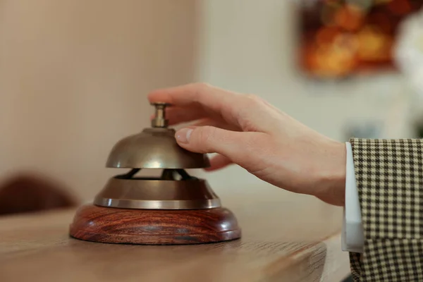 Woman Ringing Hotel Service Bell Wooden Reception Desk Closeup — ストック写真