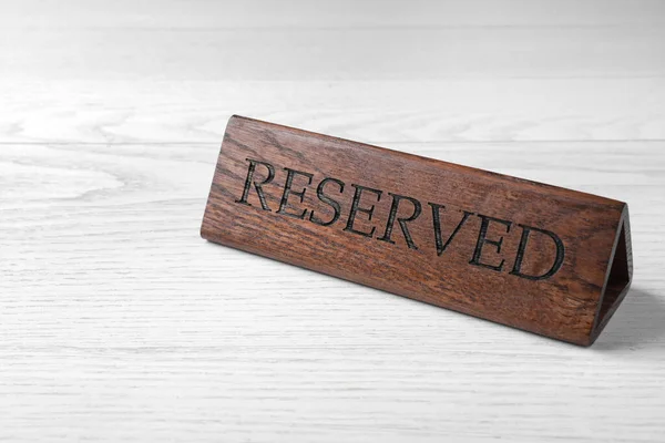 Elegant Wooden Sign Reserved White Table Space Text — Stock fotografie