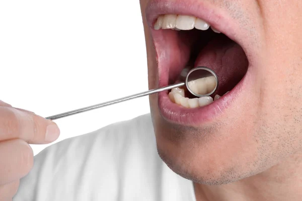 Dentist Examining Man Teeth Gums Mirror White Background Closeup — Photo
