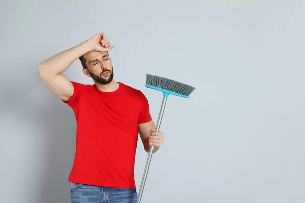 Tired Man Broom Grey Background Space Text — Stock Fotó