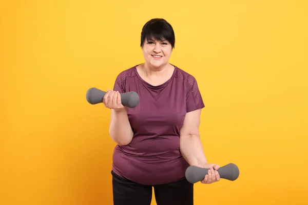 Happy Overweight Mature Woman Doing Exercise Dumbbells Orange Background — ストック写真