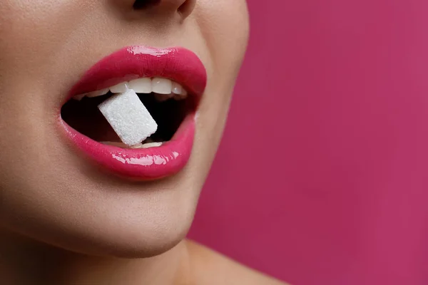 Woman Beautiful Lips Eating Sugar Cube Pink Background Closeup Space — Stockfoto